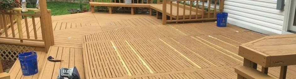 Deck boards with uneven, worn finish, before