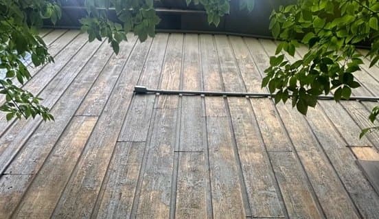 Close view of weathered gray wood boards before finishing